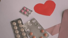 Pink ribbon representing breast cancer awareness is displayed with heart shape and medication, illustrating a message of hope and support. Breast cancer ribbon concept  - Powered by Shutterstock - Get 15% off with code: PIKWIZARD15