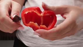 Slicing red bell pepper into slices. Close-up of female hands preparing fresh vegetable for cooking. Concept of healthy food, home kitchen, and meal prep - Powered by Shutterstock - Get 15% off with code: PIKWIZARD15