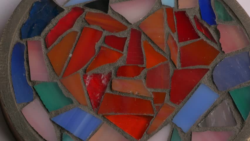 Vibrant mosaic heart design features colorful glass pieces arranged in a circular pattern, representing love and unity for World Heart Day. World heart day 