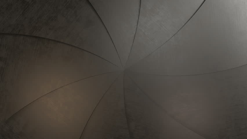 A metal opening, a close-up of a camera or lens aperture. The image conveys a technical and mechanical aesthetic. Isolated with a green chroma key and luma matte.