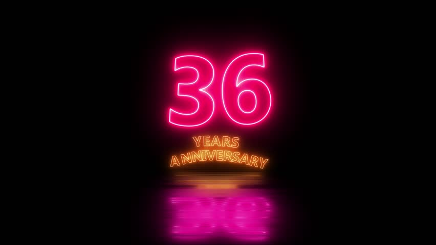 Glowing neon 36 years anniversary emblem. Anniversary icon or label. front of dazzling fireworks 36 years celebration and congratulation design element splash convert animated explosion animation.