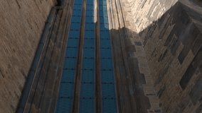 Stained glass windows on church tower. Soft sunlight filtering through colorful stained glass windows, casting intricate light and shadow patterns across weathered stone walls of historic church tower - Powered by Shutterstock - Get 15% off with code: PIKWIZARD15
