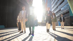 A group of confident business professionals walking together in stylish suits, showcasing unity and determination with purposeful strides and expressions that reflect ambition and success. - Powered by Shutterstock - Get 15% off with code: PIKWIZARD15
