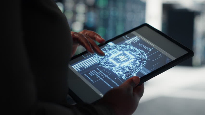 Close up of data center technician doing AI data analysis on tablet to upgrade infrastructure. Server room employee using device to manage storage systems for machine learning training datasets - Powered by Shutterstock - Get 15% off with code: PIKWIZARD15