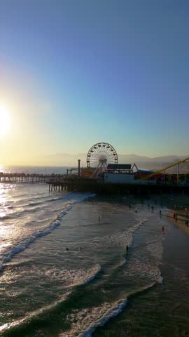 Slow Motion Vertical Drone Shot of Santa Monica Pier and Ocean Waves at Sunset, September 12, 2025
