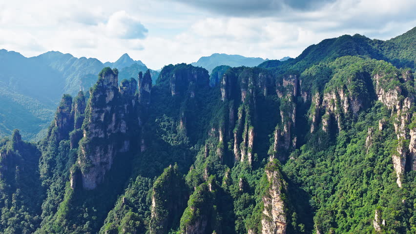 Majestic Zhangjiajie national forest park: towering sandstone pillars with lush green forest, Wulingyuan Scenic Area, Hunan Province, China.