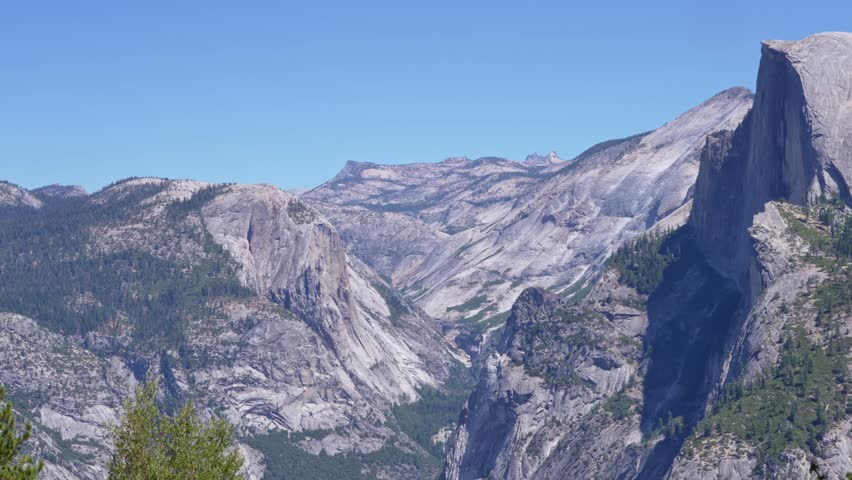 Scenic Yosemite Valley landscape pan showcasing the iconic Half Dome.