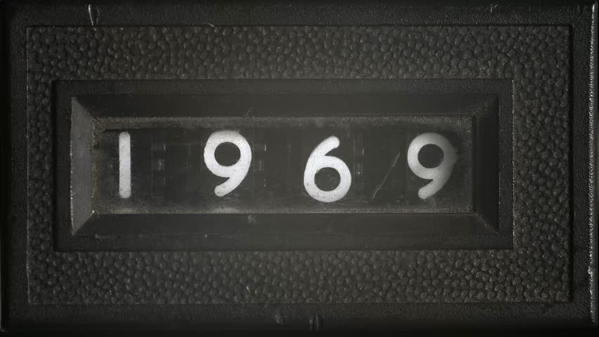 Vintage counter scrolls in reverse from 1969 to 1960, retro numeric display symbolizing countdown, history, and the passage of time.