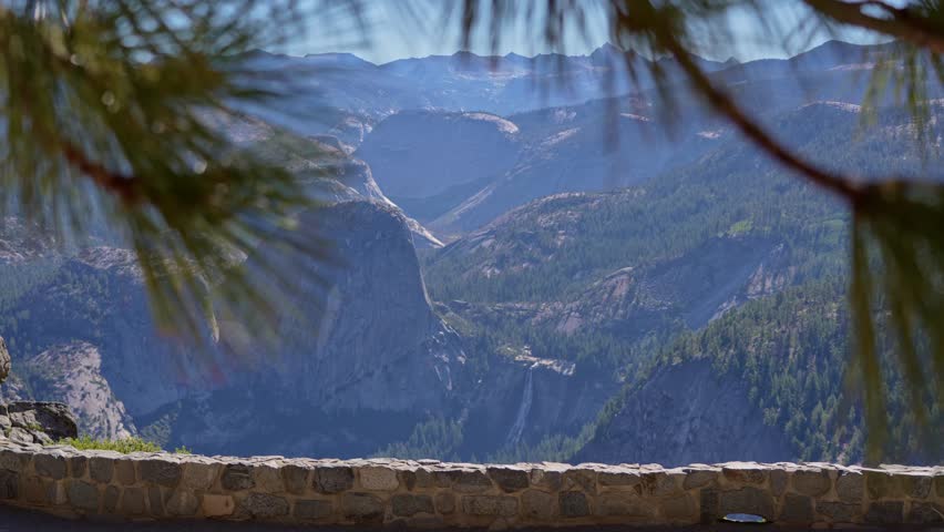 Nevada Falls in Yosemite National Park seen from a dramatic elevated vantage point, with the shot tightening on the cascading waterfall.