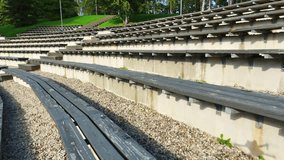 Outdoor Wooden Bleachers Of Open-Air Stadium In Talsi, Latvia. Aerial Pullback Shot - Powered by Shutterstock - Get 15% off with code: PIKWIZARD15