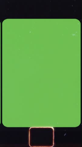 Super 8 film frame showing green screen background