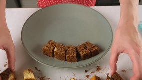 Pastry chef woman hands placing pieces of biscuit on plate cooking cake on kitchen. Baker preparing tasty sweet treat dessert. Culinary skills, cuisine homemade prepare domestic food recipe. - Powered by Shutterstock - Get 15% off with code: PIKWIZARD15