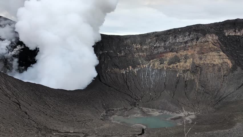 Crater with gas emanation and lagoon in the Turrialba Volcano, Costa Rica