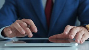 Businessman working at desk with digital tablet, stock market growth chart in foreground, illustrating finance, trading, digital design, business planning, and investment success. - Powered by Shutterstock - Get 15% off with code: PIKWIZARD15