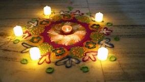 festive diwali rangoli artwork decorated with candles and bright colors outdoors - Powered by Shutterstock - Get 15% off with code: PIKWIZARD15