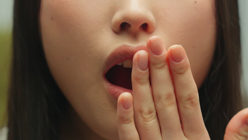 Close up female open mouth covering with hand unrecognizable scared woman feeling shock wondering emotion amazement stunned girl Asian lady wow astonish surprise amazing news disbelief overwhelmed