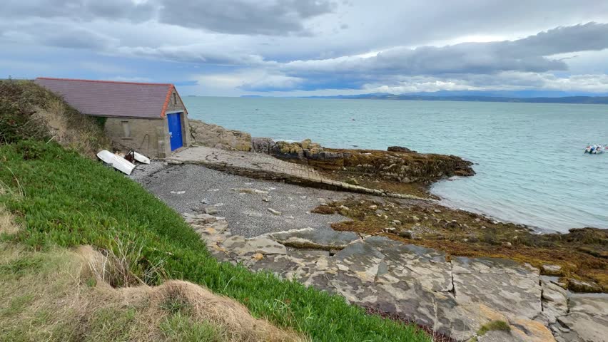 The coastline at low tide at Moelfre on the coast of Anglesey in north Wales in the United Kingdom