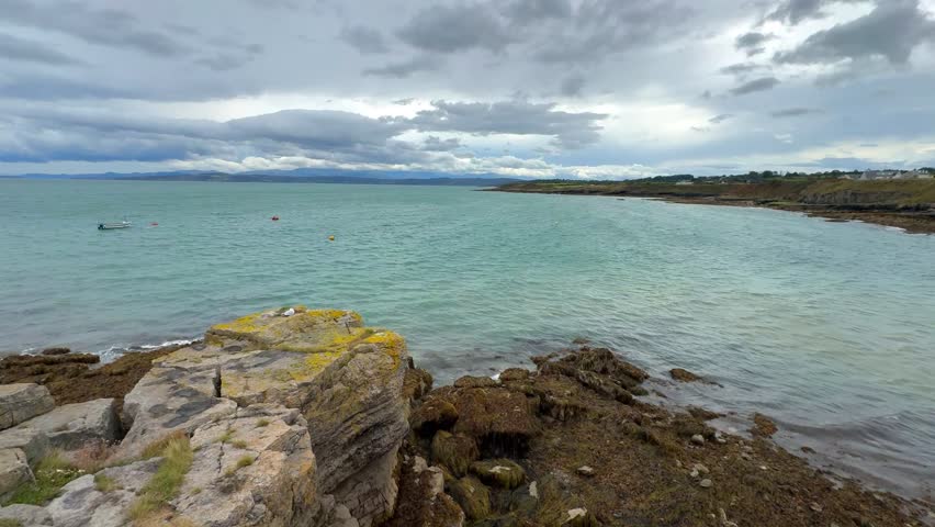 The coastline at low tide at Moelfre on the coast of Anglesey in north Wales in the United Kingdom