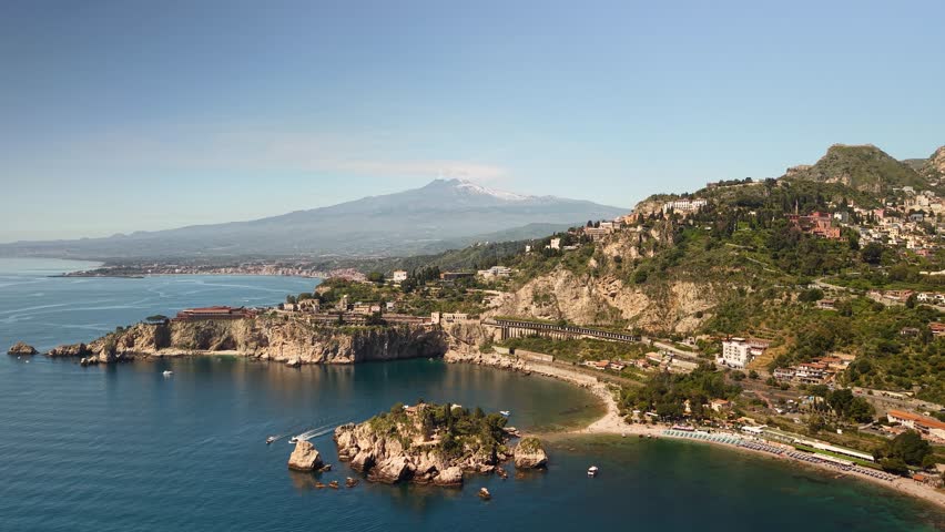 Stunning Isola Bella island aerial view with mount Etna Italian seascape on the horizon