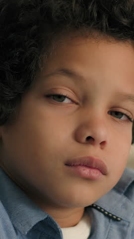 Portrait upset disappointed African little boy son frustrated thoughtful child kid American offended baby think looking at camera sadness emotion male schoolboy toddler orphan suffer custody indoors