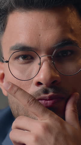 Serious pensive business man Arabian Hispanic businessman holding chin hesitate job difficulty work strategy thinking ethnic guy Indian male looking at camera close up thoughtful worker creating idea