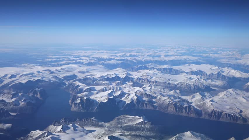 Aerial flyover of glacier-covered fjords on Baffin Island, Nunavut, Canada