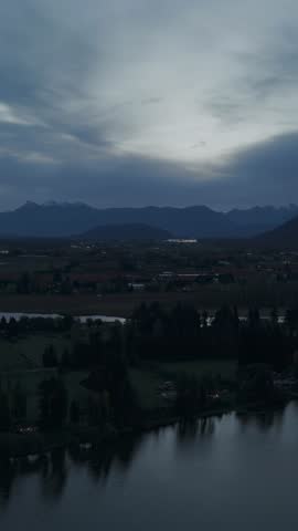 Twilight Panorama Over a Serene Lake and Valley with Majestic Mountains in British Columbia, Canada