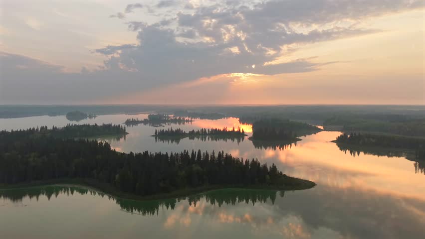 Aerial sunrise over forested lakes in Elk Island National Park, Alberta