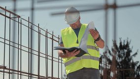 Construction Engineer Reviewing Project Plans On Site, Man In Safety Vest And Helmet Holding Papers While Inspecting Reinforcement Structure Under Bright Sky - Powered by Shutterstock - Get 15% off with code: PIKWIZARD15
