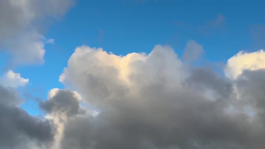 Beautiful clouds drift across the evening sky