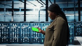 Server hub admin uses isolated screen smartphone to watch video tutorial on how to increase rigs workload capacity. Data center worker following guide on chroma key phone to improve speed, camera A - Powered by Shutterstock - Get 15% off with code: PIKWIZARD15