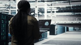 Computer scientist doing data center automation using AI on laptop. Server room IT specialist implements machine learning driven predictive maintenance systems using notebook, camera A - Powered by Shutterstock - Get 15% off with code: PIKWIZARD15