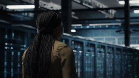 Programmer overseeing high tech server farm, ensuring compliance with industry standards. Data center IT professional conducts security audits to protect against cyber threats and glitches, camera B - Powered by Shutterstock - Get 15% off with code: PIKWIZARD15