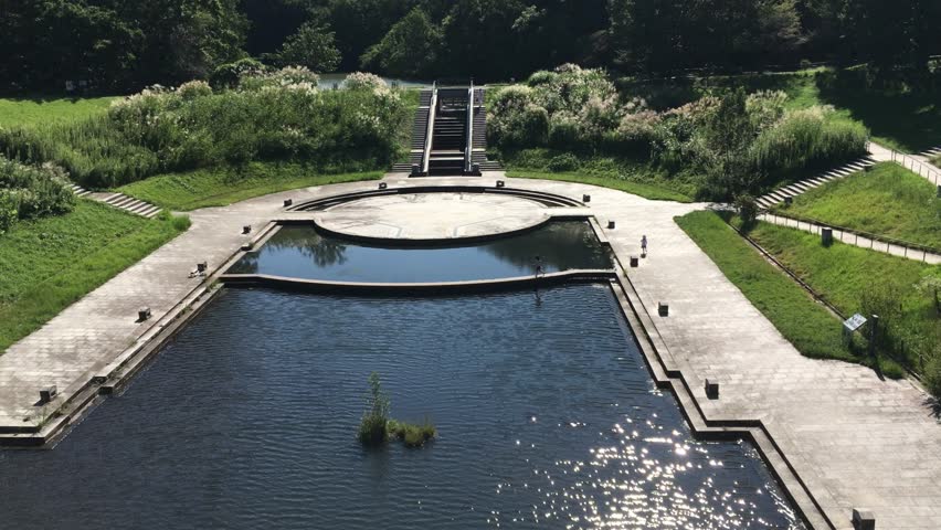 Residential park, ornamental pond, serene oasis, community garden, tranquil retreat