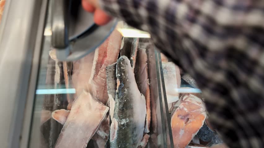Salmon steaks and other delicacy fish in a refrigerator at a supermarket or farmers market, healthy products in the store.
