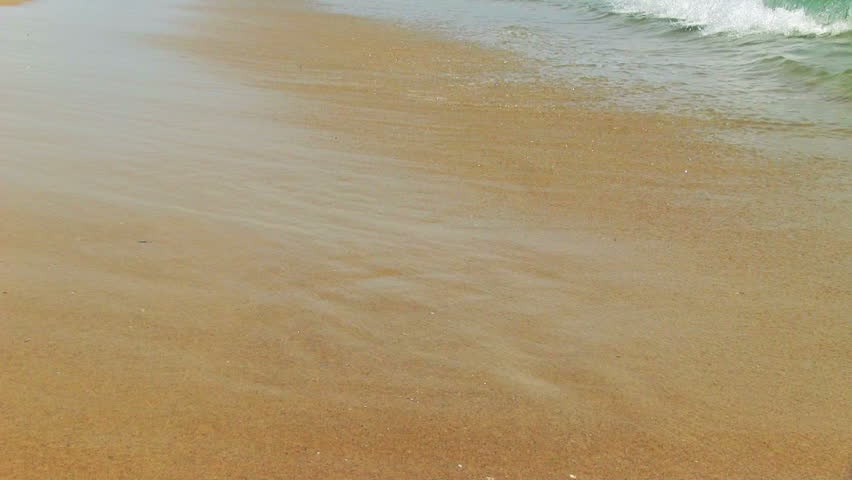 Wave on sand