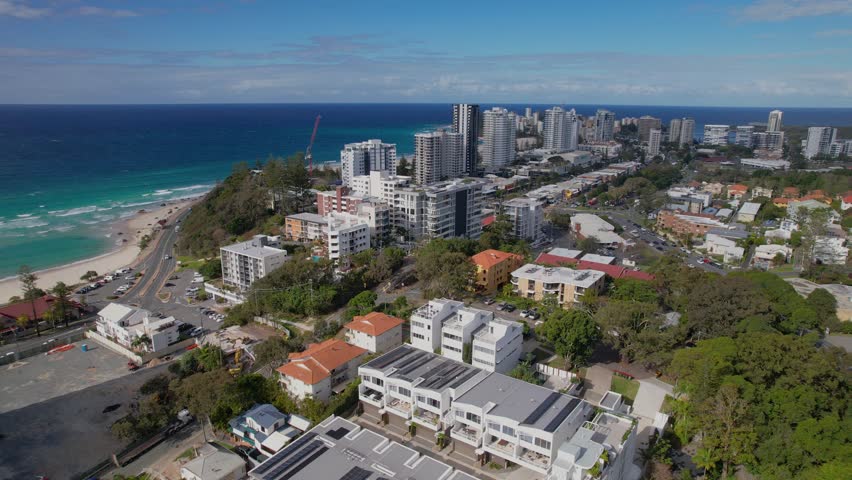Aerial views of the Kirra urban beach front skyline along the Gold Coast region of Queensland, Australia