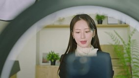 Woman Filming with Smartphone and Ring Light – Social Media Content Creator - Powered by Shutterstock - Get 15% off with code: PIKWIZARD15