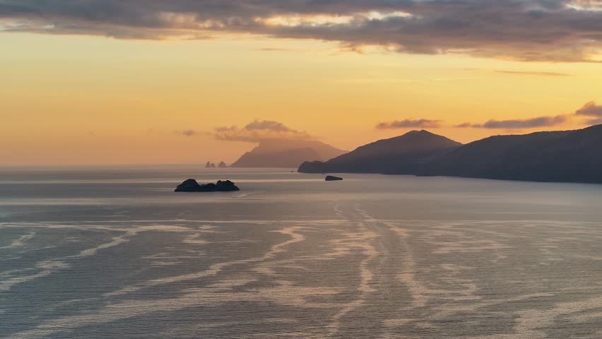 Sunset Landscape Of Capri Island At Naples In Campania Italy. Beach Landscape. Giant Cliffs Scene. Capri Island At Campania Italy. Sunset Skyline. Gulf Of Naples Mediterranean Sea. Sunset Over Ocean.
