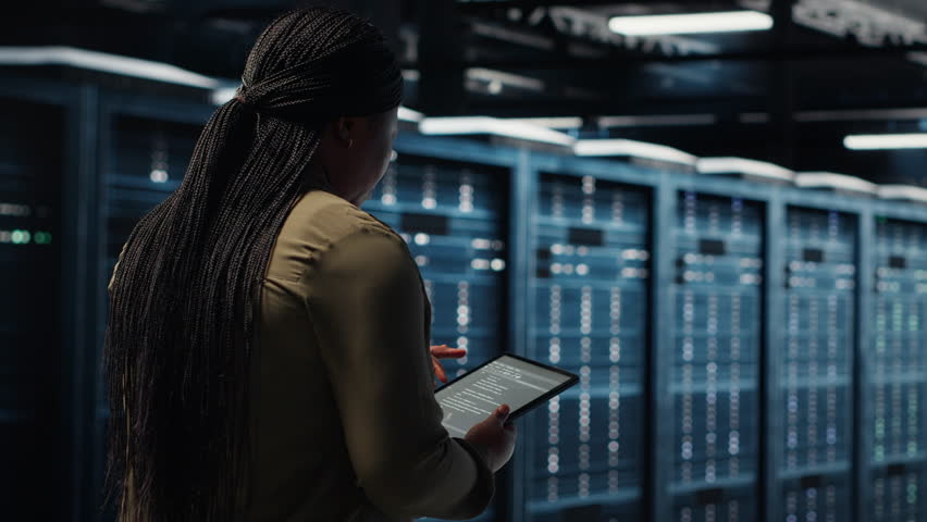 Close up of data center programmer doing data analysis on tablet to upgrade infrastructure. African american woman in server room using device to manage storage systems datasets - Powered by Shutterstock - Get 15% off with code: PIKWIZARD15