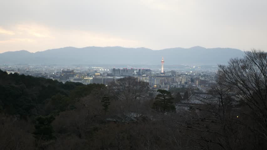 aerial landscape panoramic view over Kyoto city center among mountain range in winter sundown time.panoramic aerial landscape view of Kyoto from view point