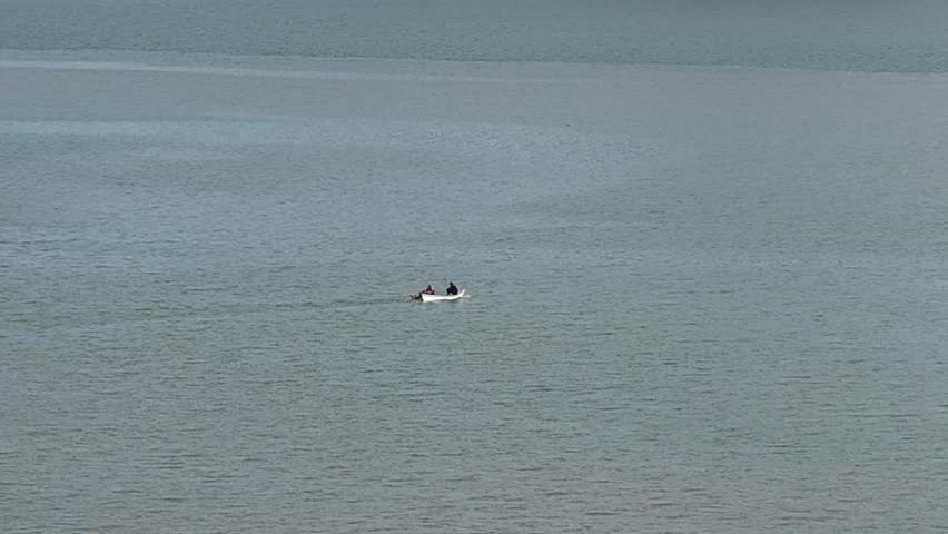 A small fishing boat in the middle of the sea