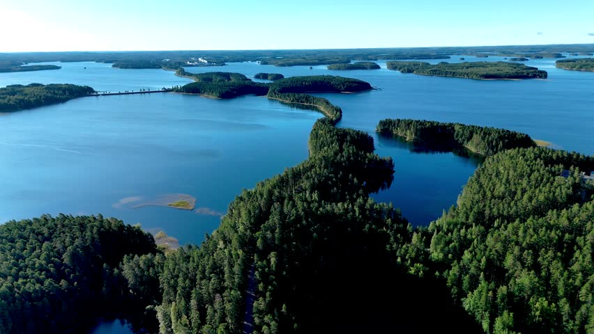 Experience the stunning vistas of Punkaharju, Finland, where lush forests meet sparkling waters. This captivating landforms showcase natures splendor in harmony, inviting exploration and tranquility.
