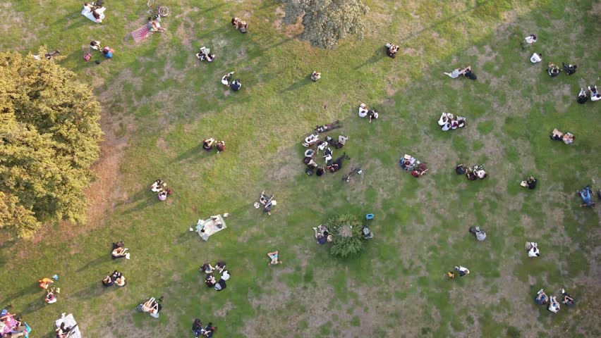People chilling in a big park in Berlin city center