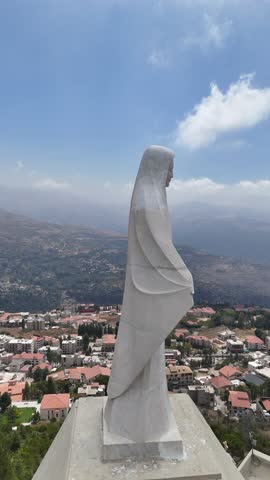 Aerial view of Saydet elHosn in Ehden and the Lebanese Flag 