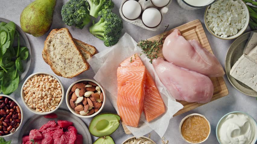 flat lay composition of various fresh protein diet products on grey background, top view. healthy eating, various fresh healthy products on grey table, top view. Healthy food clean eating selection