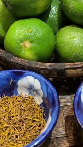 Fresh lime and lemongrass displayed at a modern supermarket, showcasing vibrant color and natural texture, ideal for cooking ingredients, beverages, and herbal remedies.