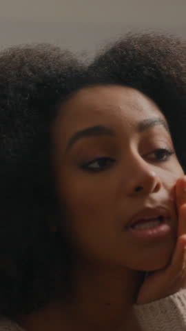 African American girl woman female looking at mirror reflection touching skin checking make-up beauty with face wrinkles bad cosmetology dermatology complexion acne trouble facial skincare at home