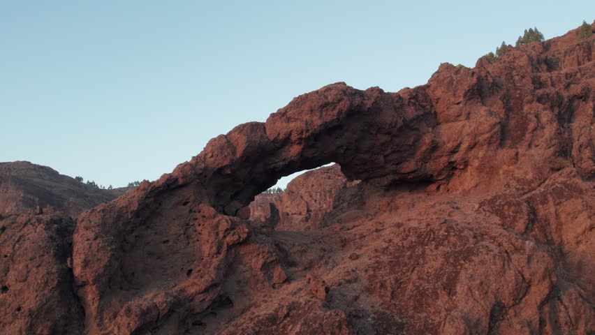 Little-known places on the island of Gran Canaria: Aerial view Del Cuchillon arch, rock formation during a beautiful sunset. Canary Islands, Spain.
