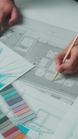 Closeup architecture design project blueprint business team Arabian man architect designer writing notes talking with muslim women in hijab three office partners discuss interior drawing building plan
